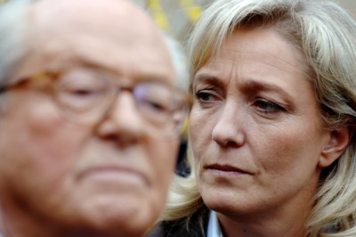 (FILES) - A photo taken on March 17, 2007 shows Marine Le Pen (R) listening to her father, France's far-right Front national party's (FN) president and presidential candidate Jean-Marie Le Pen, as he delivers a speech in his house in La Trinite-Sur-Mer, western France. France's far-right was plunged into disarray on April 8 as National Front leader Marine Le Pen openly split with her father and party founder after gas chamber comments she described as "political suicide".  AFP PHOTO / MARTIN BUREAU